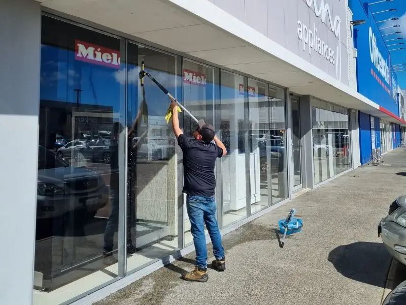 image of man cleaning the window